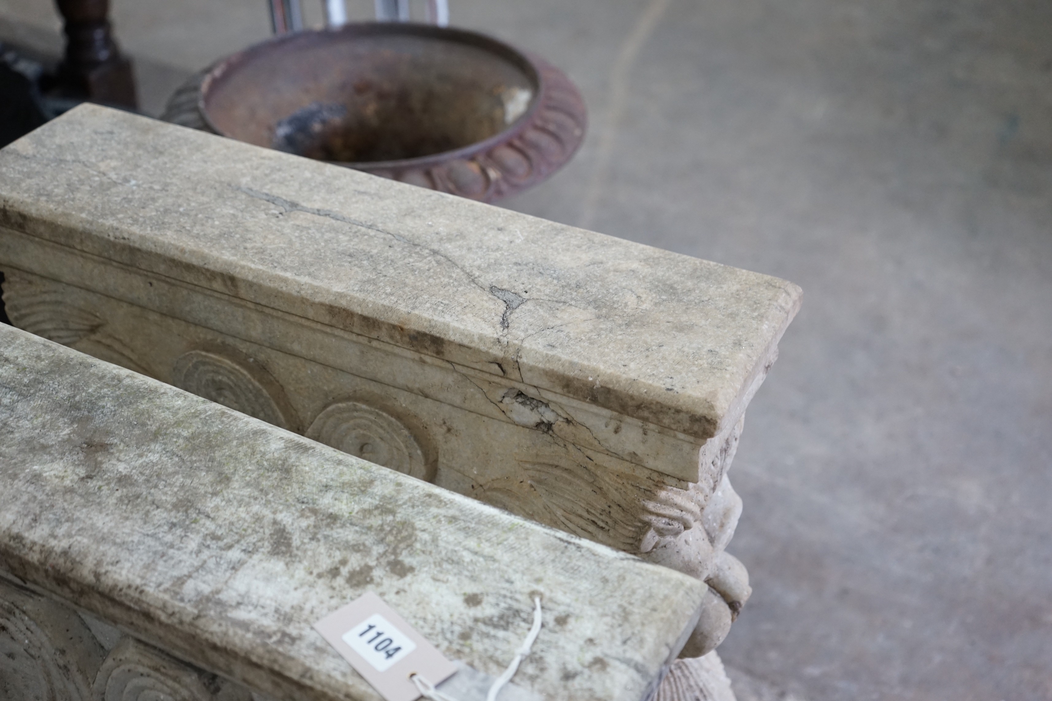 A near pair of carved stone lion table supports, width 59cm, height 77cm